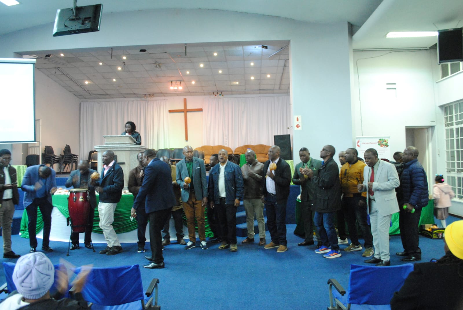 Men's Fellowship (MUMC) leading in song
